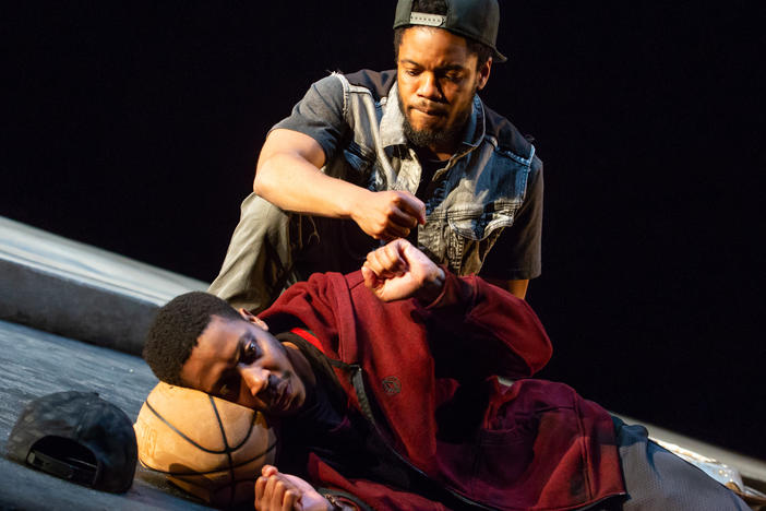 Jon Michael Hill (seated) and Namir Smallwood star in <em>Pass Over, </em>the first play to return to Broadway since the COVID-19 closure.