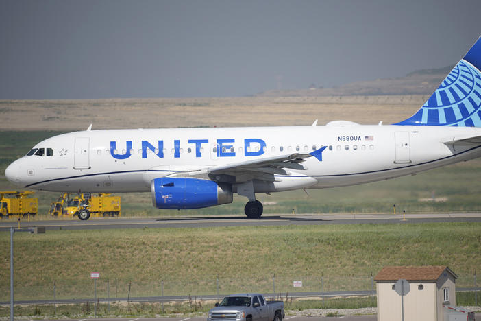A United Airlines jetliner taxis down a runway for take off from Denver International Airport last month. The carrier has become the first major U.S. airline to require employees be vaccinated against COVID-19.