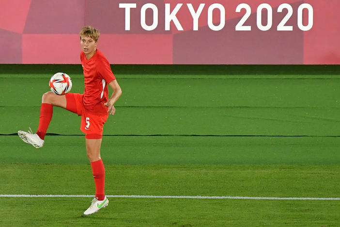 Canada's midfielder Quinn warms up prior to the Tokyo Olympics women's final soccer match between Sweden and Canada on Aug. 6.