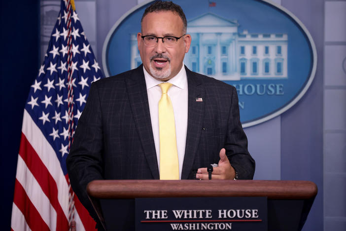 U.S. Education Secretary Miguel Cardona answers questions during a White House news briefing on Thursday.
