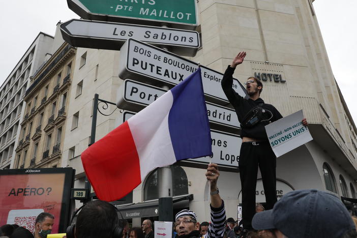 Protesters gathered in Paris on Saturday to oppose a requirement to use a health pass to enter businesses or use public transportation.