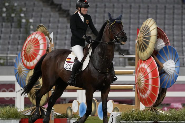 Annika Schleu of Germany cries after failing to control her horse while competing in the equestrian portion of the women's modern pentathlon at the 2020 Summer Olympics on Friday.