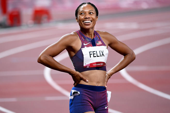 U.S. track star Allyson Felix smiles after winning the bronze medal in the 400 meter race on Friday.