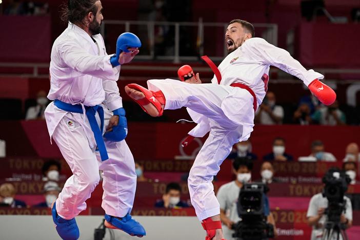 Azerbaijan's Rafael Aghayev (L) competes against Hungary's Karoly Gabor Harspataki in the men's kumite -75kg semi-final of the karate competition during the Tokyo 2020 Olympic Games on Friday.