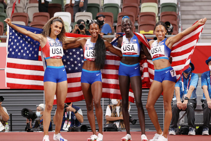 U.S. runners (from left) Sydney McLaughlin, Dalilah Muhammad, Athing Mu and Allyson Felix celebrate winning the gold medal in the women's 4x400 meter relay at the Tokyo Olympic Games.