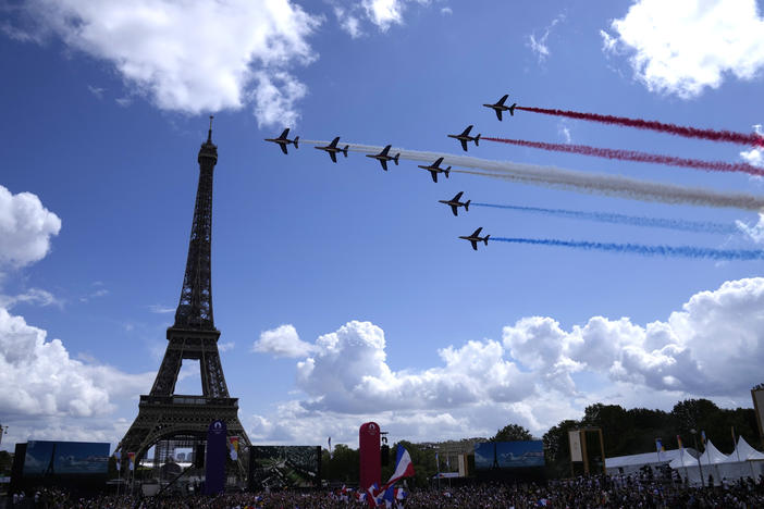 The French Aerial Patrol fly by the Eiffel Tower in Paris as part of the handover ceremony of Tokyo 2020 to Paris 2024, as Paris will be the next Summer Games host in 2024.