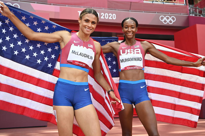 Team USA topped the medals list at the Tokyo Games, narrowly edging China in golds. Here, track stars Sydney McLaughlin (left) and Dalilah Muhammad celebrate winning gold and silver respectively in the women's 400-meter hurdles in Tokyo.