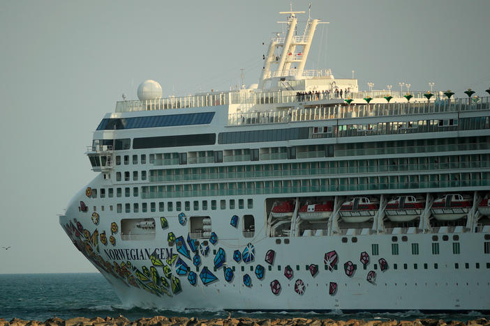 The Norwegian Gem cruise ship leaves the Port of Miami in April 2020. The Norwegian Gem's first trip since a pandemic-induced hiatus is scheduled to sail from Miami on Aug. 15.