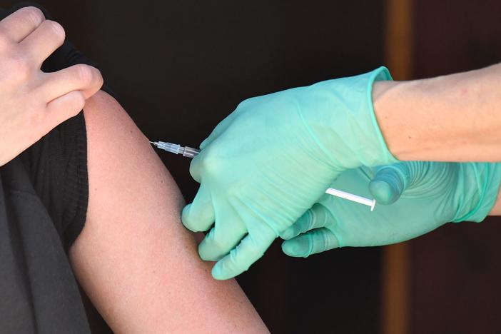 A medical assistant administers the Johnson & Johnson COVID-19 vaccine in May in Berlin's Friedrichshain district.