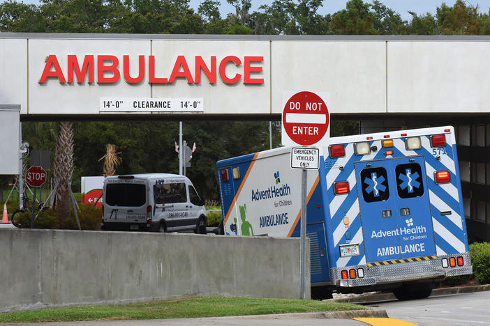 An ambulance arrives at the emergency department at AdventHealth hospital in Orlando in late July. Florida is one of several states seeing disappearing hospital capacity as COVID-19 cases surge.