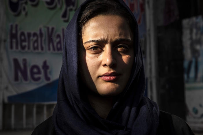 Dawlatt Naimati, 22, from Kunduz, stands outside an internet café where she is seeking help applying for a U.S. special immigrant visa on Aug. 8, in Kabul, Afghanistan.