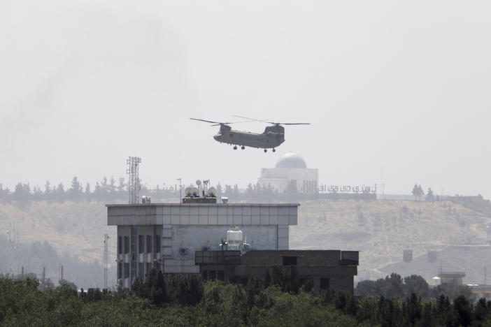 <strong>Sun., Aug. 15:</strong> A U.S. Chinook helicopter flies near the U.S. Embassy in Kabul, Afghanistan