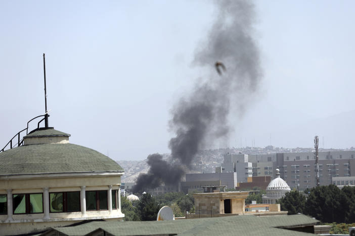 Smoke rises next to the U.S. Embassy in Kabul, on Sunday. Taliban fighters have entered the outskirts of the Afghan capital, further tightening their grip on the country.