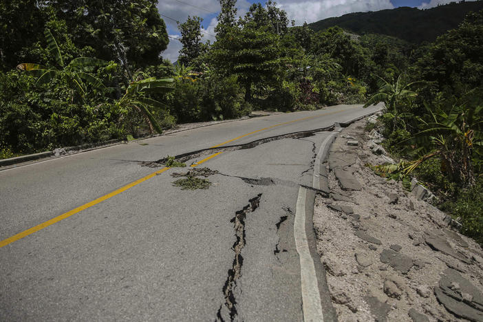 A road is seen damaged by the earthquake in Camp-Perrin, Les Cayes, Haiti, Sunday, Aug. 15, 2021.