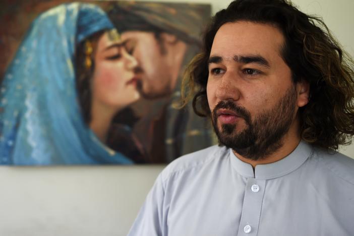 ArtLords co-creator Omaid Sharifi speaks during an interview at his studio in Kabul in August 2019. With the Taliban overrunning the capital on Sunday, he says his is unsure what the future holds for his art and his organization.