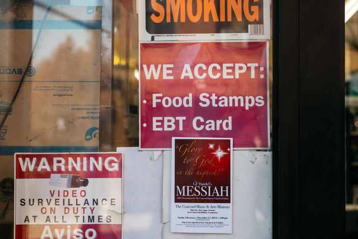 A sign alerts customers about SNAP food stamp benefits at a grocery store in New York City in December 2019. Benefits from the Supplemental Nutrition Assistance Program are getting a historic boost nearly two years later under the Biden administration.