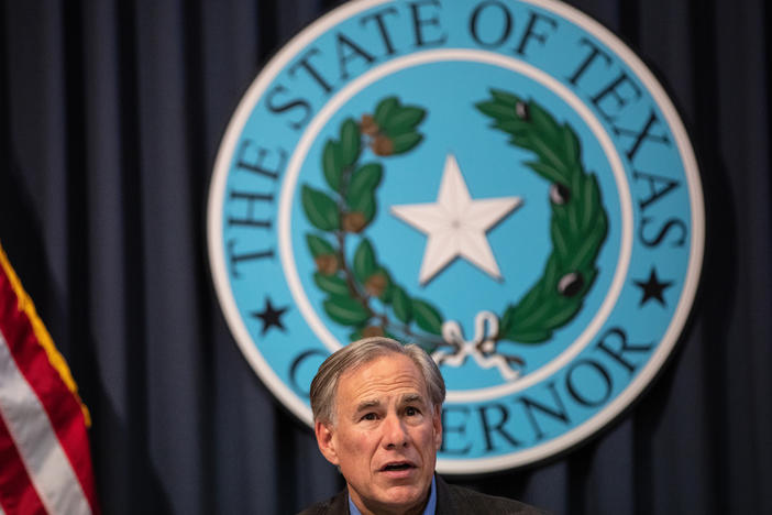 Texas Gov. Greg Abbott, pictured here in July, is not experiencing any symptoms, his office said Tuesday.