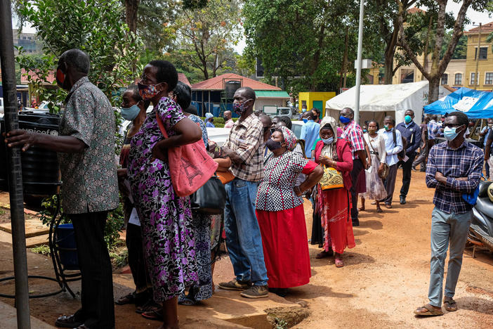 People line up last week to receive COVID-19 vaccines in Kampala, Uganda, after weeks of no supply. In Uganda, only 2.2% of the population had received one dose of a vaccine as of Aug. 15.