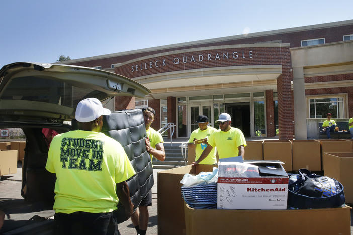Workers help students move in to Selleck Hall, at the University of Nebraska–Lincoln.
