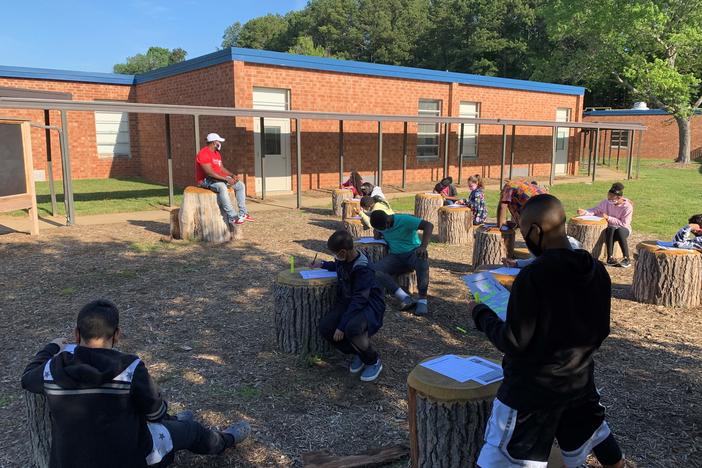 Students at Foust Elementary School in Greensboro, North Carolina gather in an outdoor classroom.