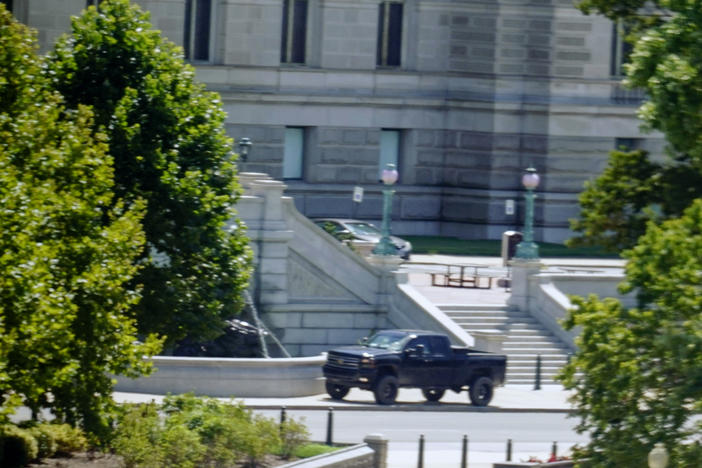 A pickup is parked Thursday on the sidewalk in front of the Library of Congress' Thomas Jefferson Building, as seen from a window of the U.S. Capitol. A man sitting in the truck told police he had a bomb. He later surrendered.