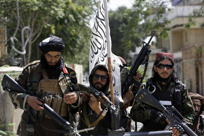 Taliban fighters patrol through Kabul, Afghanistan, on Thursday. Pictures of such fighters posing with captured aircraft, weapons and vehicles have been showing upon social media.