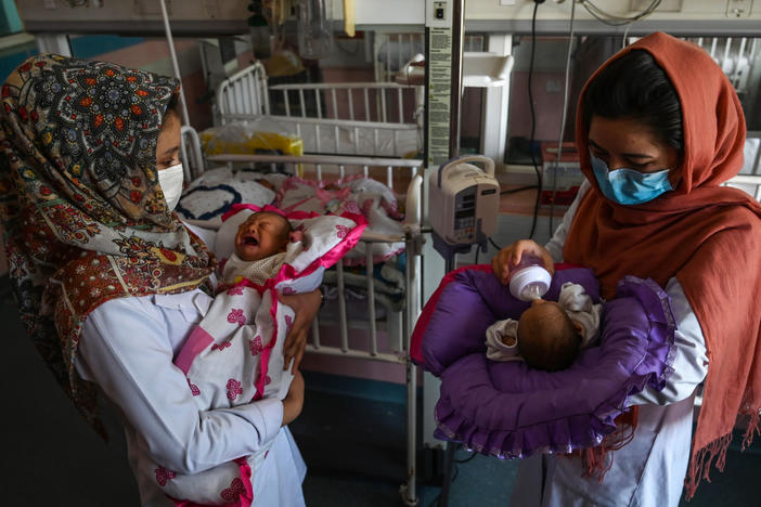 Nurses feed newborn babies rescued and brought to Ataturk National Children's Hospital in Kabul, Afghanistan, on May 15, 2020, after their mothers were killed in an attack on a maternity ward operated by Doctors Without Borders. The health-care nonprofit runs clinics and hospitals in various parts of the country.