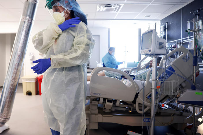 Clinicians care for COVID-19 patients in a converted negative pressure room in the intensive care unit at Lake Charles Memorial Hospital on Aug. 10 in Lake Charles, La. The floor has been converted into an ICU strictly for COVID-19 patients.