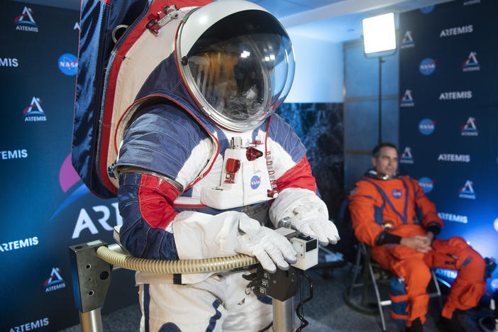 The two NASA spacesuit prototypes, one for exploring the surface of the moon's South Pole (left) and one for launch and reentry aboard the agency's Orion spacecraft, won't become a reality in time for a planned 2024 mission.