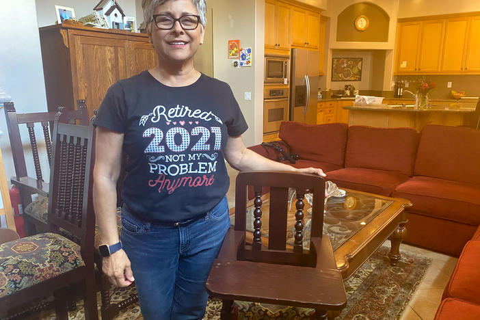 Norma Jasso, 62, sped up retirement plans after her daughter asked for help with a new baby. She stands with a highchair her father had commissioned from a shop in Sinaloa, Mexico. Her daughters used it and now her grandson will too.