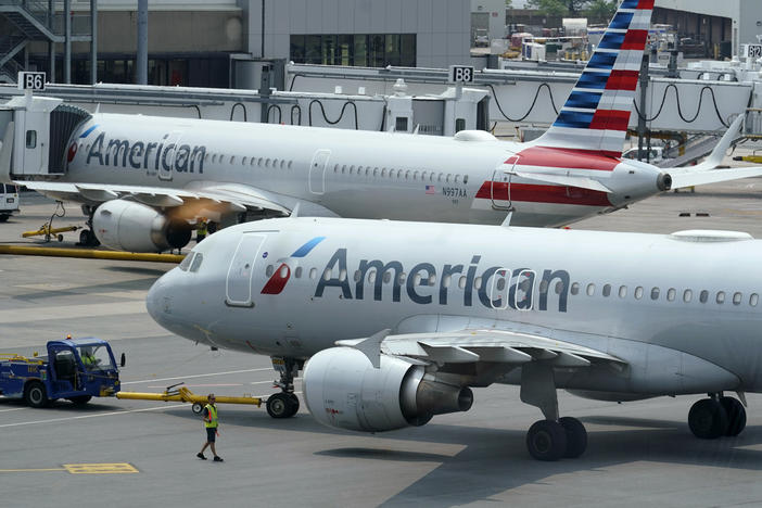 American Airlines passenger jets prepare for departure at Boston Logan International Airport in July. American is one of six airlines the Pentagon is turning to for assistance with the Afghan evacuation effort.