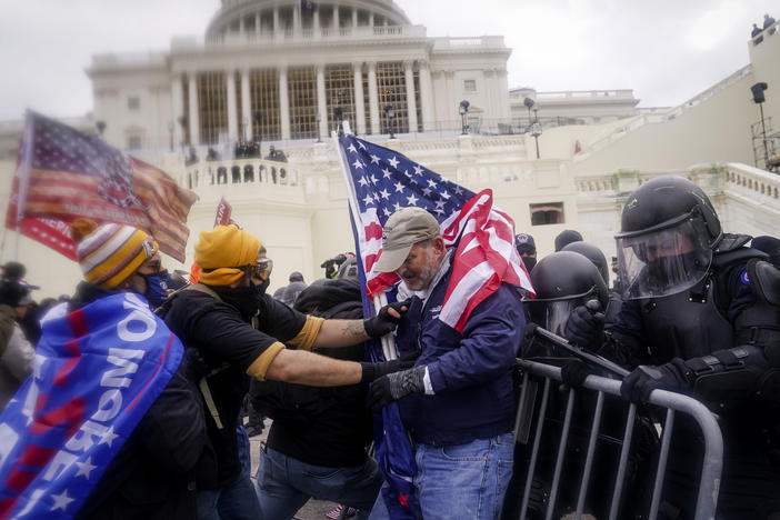 Rioters try to break through a police barrier at the U.S. Capitol on Jan. 6.