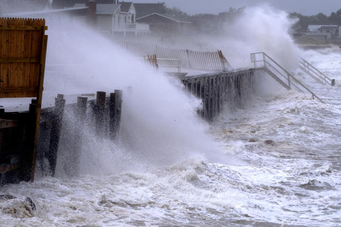 Waves pound a seawall in Montauk, N.Y., on Sunday, as Tropical Storm Henri affects the Atlantic Coast.