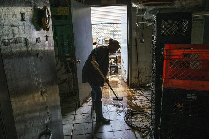A worker cleans inside Four Boys Ice Cream store in Jamesburg, N.J., on Monday.