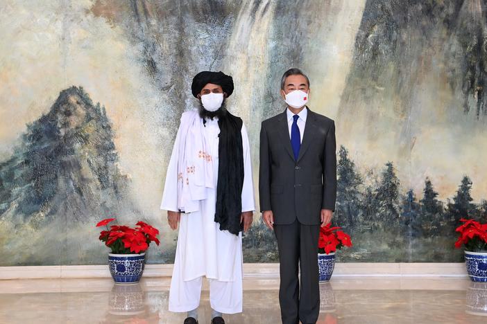 Chinese Foreign Minister Wang Yi meets with Afghan Taliban leader Abdul Ghani Baradar in Tianjin, China, on July 28.