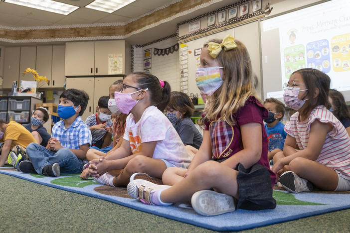 Students listen to their teacher during their first day of transitional kindergarten this month at Tustin Ranch Elementary School in Tustin, Calif.