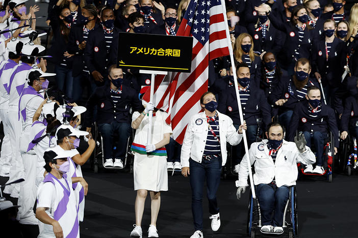 Flag bearers Melissa Stockwell and Charles Aoki of Team USA lead their delegation in the parade of athletes during the opening ceremony of the Tokyo 2020 Paralympic Games on August 24, 2021 in Tokyo, Japan.