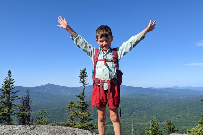 In this July 23 family photo, 5-year-old Harvey Sutton raises his arms while hiking the Appalachian Trail with his parents, Josh and Cassie Sutton.
