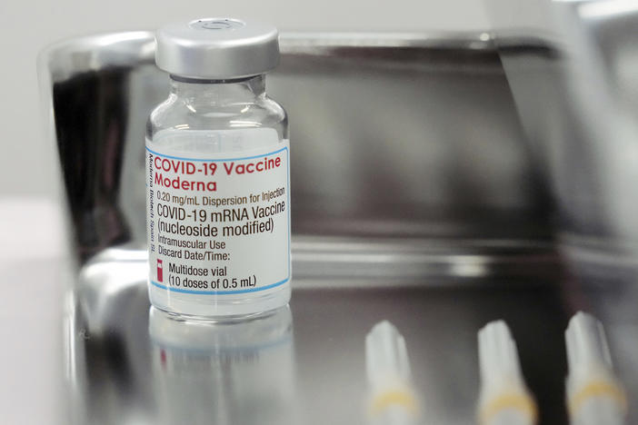This June 14, 2021, file photo shows a Moderna COVID-19 vaccine vial that is being administered for flight attendants of Japan Airlines at Haneda Airport in Tokyo.