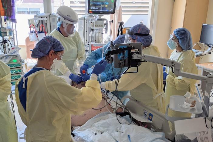 A team at Asante Rogue Regional Medical Center in southern Oregon prepares to intubate a COVID-19 patient.