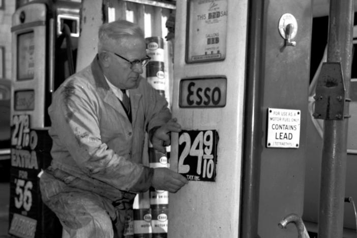 In December 1955, a man posts a price for leaded gasoline at a station in Everett, Massachusetts. The United Nations said on Monday that the world is no longer using the toxic fuel, bringing an end to a century of damaging pollution.