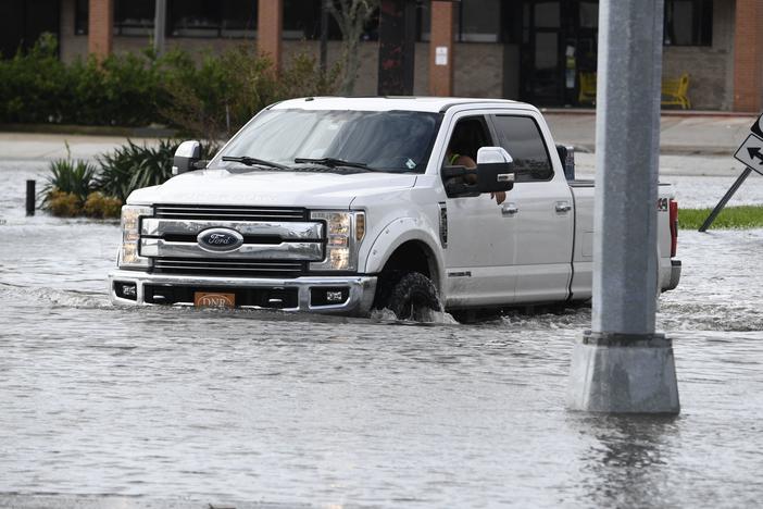 A truck in high water from Hurricane Ida near Highway 61 in Destrehan, Louisiana, on August 30, 2021.