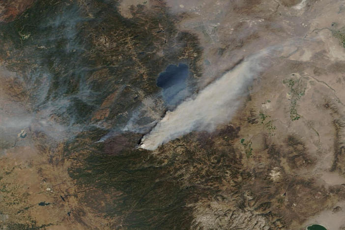 This Sunday, Aug. 29, 2021, image provided by Maxar Technologies, shows a Moderate Resolution Imaging Spectroradiometer (MODIS), a true-color image overview of the wildfires at Lake Tahoe, in South Lake Tahoe, Calif. Climate change has made the region warmer and drier in the past 30 years and will continue to make the weather more extreme and wildfires more destructive, according to scientists.