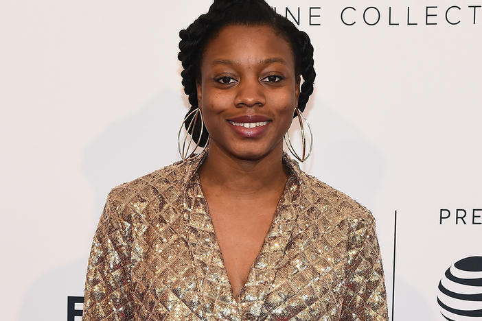 Director and screenwriter Nia DaCosta (shown here in 2018) has made history with the debut of her horror film <em>Candyman.</em>