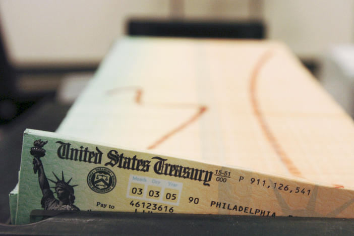 In this Feb. 11, 2005 file photo, trays of printed social security checks wait to be mailed from the U.S. Treasury's Financial Management services facility in Philadelphia. The financial impact of the coronavirus pandemic on Social Security and Medicare is front and center as the government releases its annual report on the state of the bedrock retirement programs on Tuesday, Aug. 31, 2021.