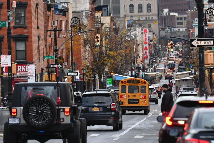 A school bus drives down a street on the first day of school reopening on December 7, 2020 in the Brooklyn borough of New York City.