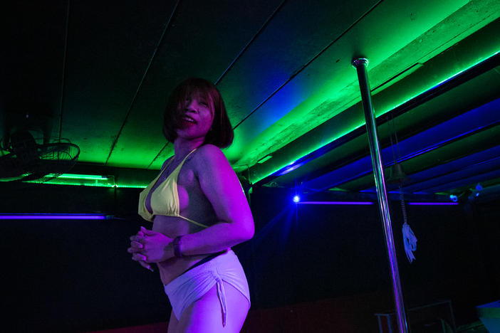 M. dances at a go-go bar. She was working as a topless dancer — and also as a sex worker — in the tourist city of Pattaya, Thailand, until the bar closed down in January. She decided to return to her hometown to look for work in a different sector.