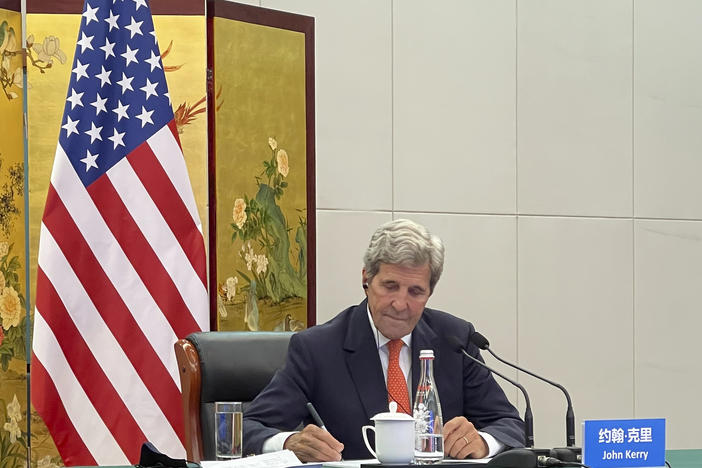 In this photo provided by the U.S. Department of State, U.S. Special Presidential Envoy for Climate John Kerry attends a meeting with Chinese Foreign Minister Wang Yi via video link in Tianjin, China, Wednesday, Sept. 1, 2021. Wang warned Kerry on Wednesday that deteriorating U.S.-China relations could undermine cooperation between the two on climate change.