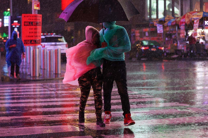 Heavy rainfall makes for a stormy Times Square outing Wednesday in New York City.