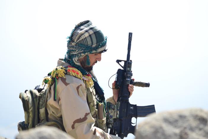 An Afghan anti-Taliban fighter is seen on a hilltop in Anaba district in Afghanistan's Panjshir province on Wednesday.